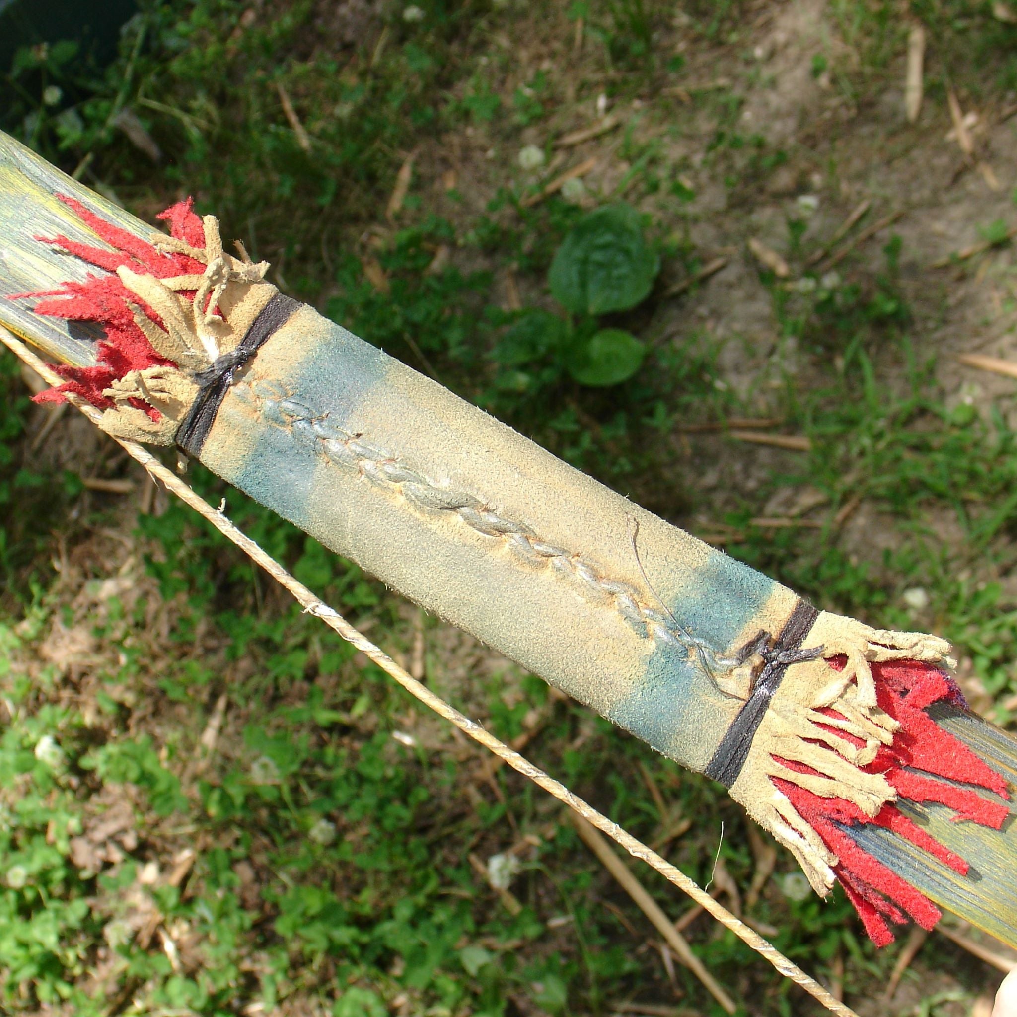 Close-up of leather handle with blue paint detail
