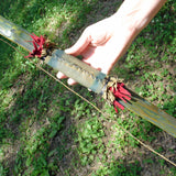 Comanche style Bow stitched leather handle detail with red trade cloth fringe