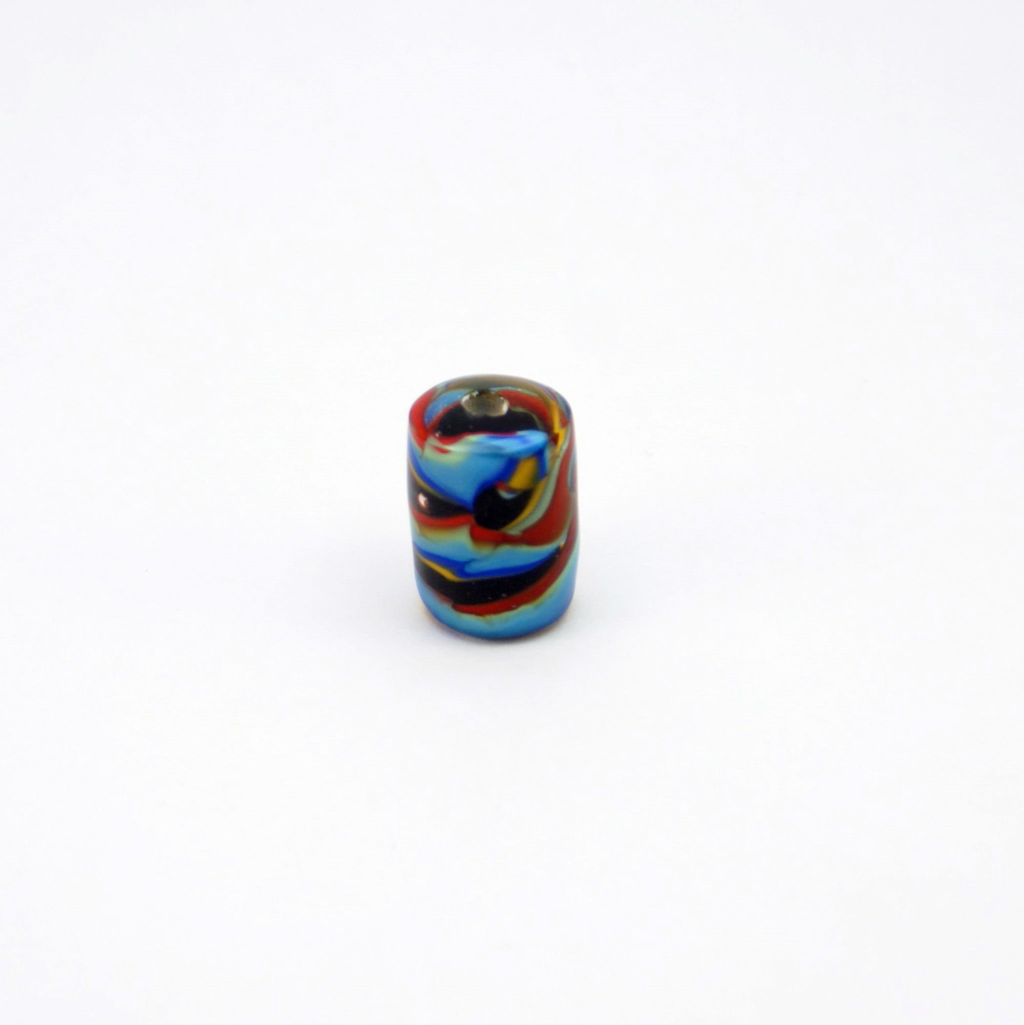 Lampwork glass tube bead on end with bright colors on black core