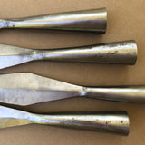 close-up of defects on 4 socketed steel lance heads