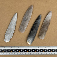 reverse side of 4 slender flint knife blades