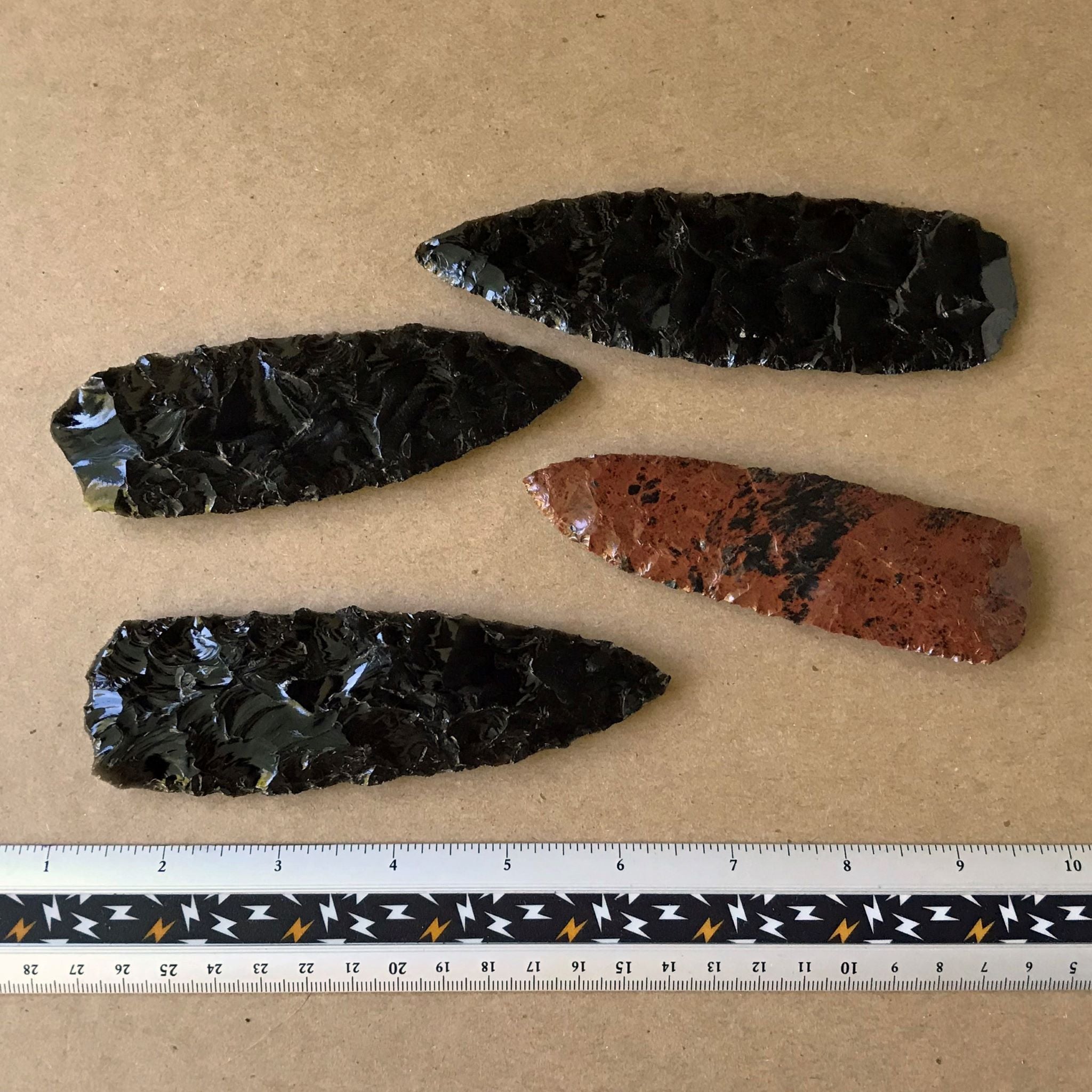 3 black obsidian knife blades, 1 mahogany obsidian knife blades