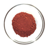 bowl of bright red ochre pigment