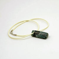 Blue-green & black Costa Rica stone triangle bead on ivory cord