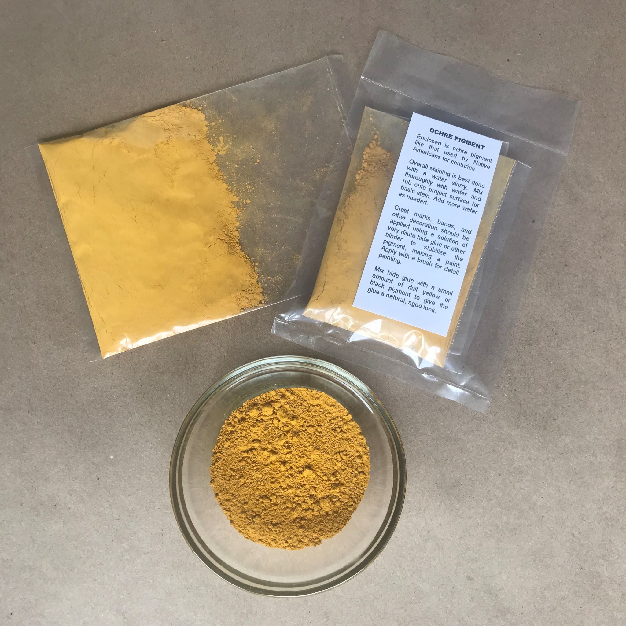 Packaged yellow ochre with instructions with bowl of pigment