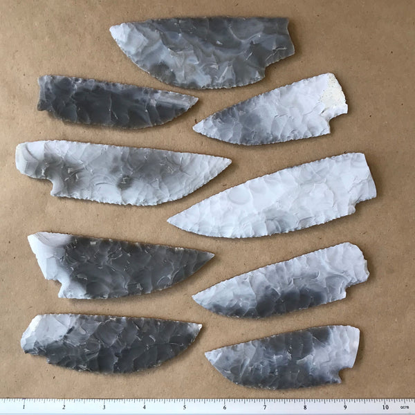 Thin finely flaked flint knife blades in three sizes