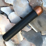 Copper-domed flintknapping tool with black wooden handle