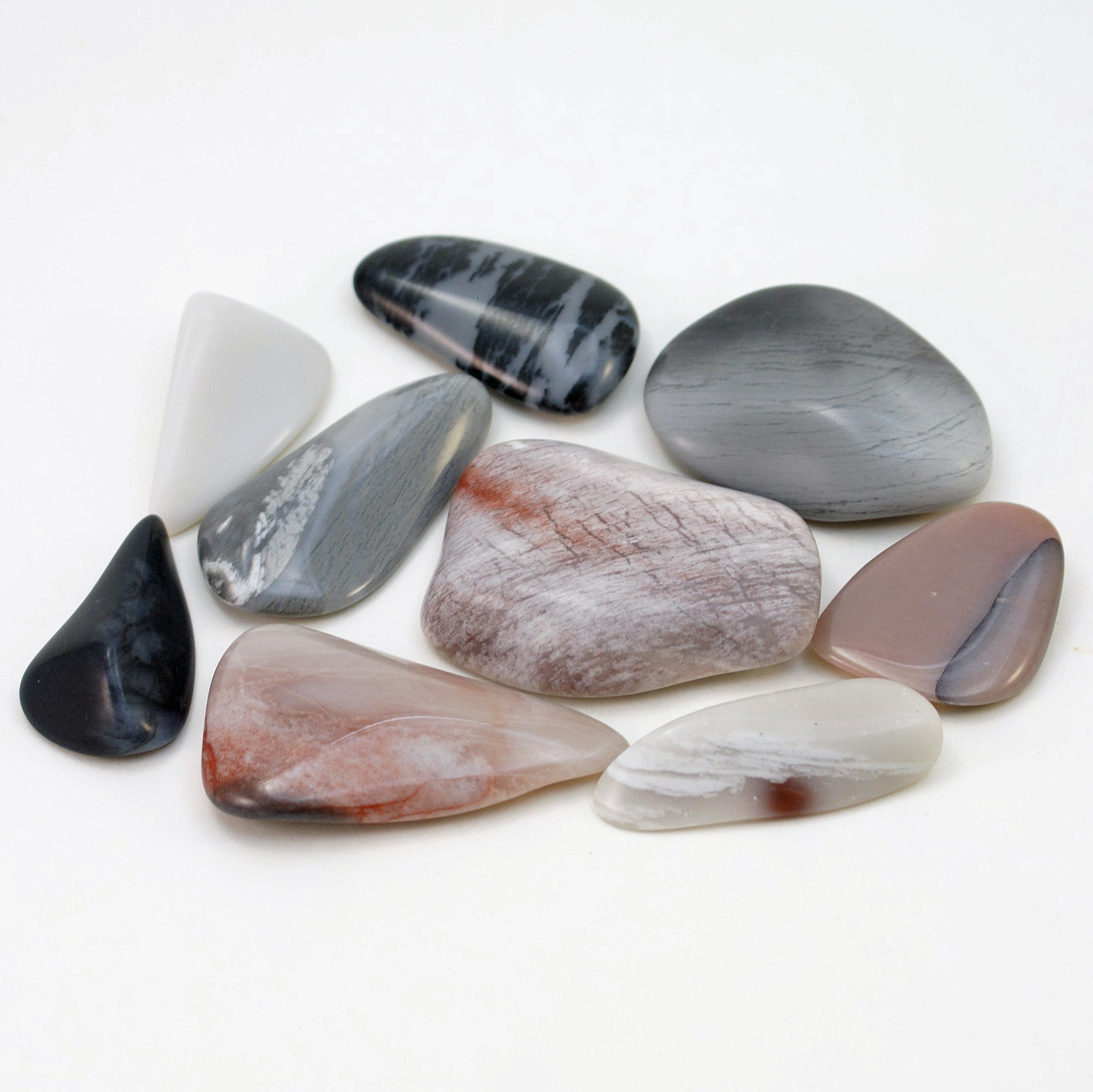 Group of 9 tumbled multi-colored novaculite stones
