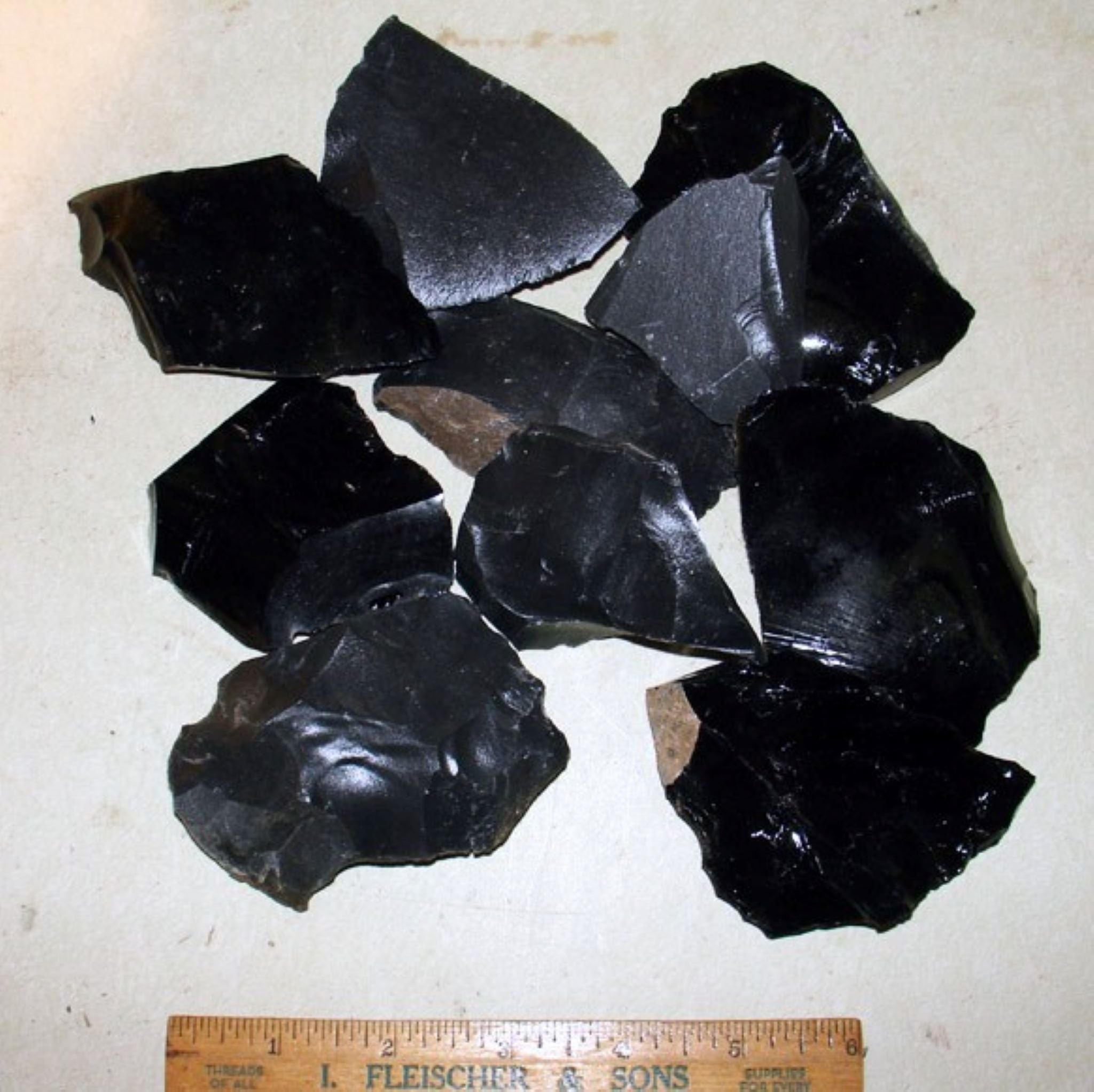 Black obsidian & dacite small spalls with ruler