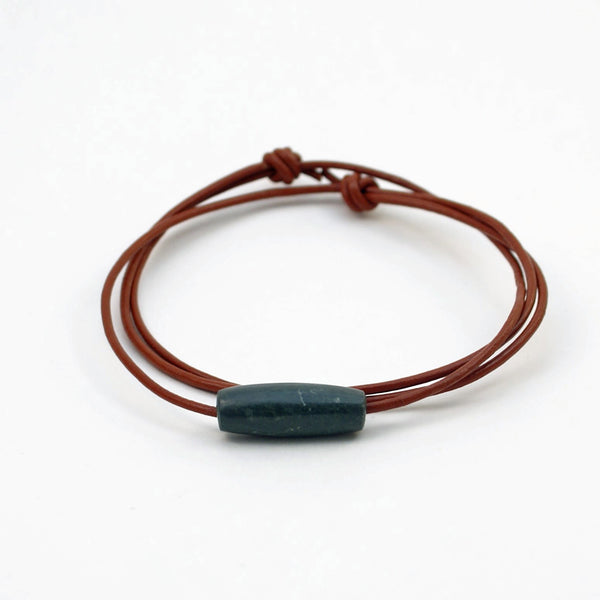 Costa Rican blue-green tube bead with burnt-red leather cord